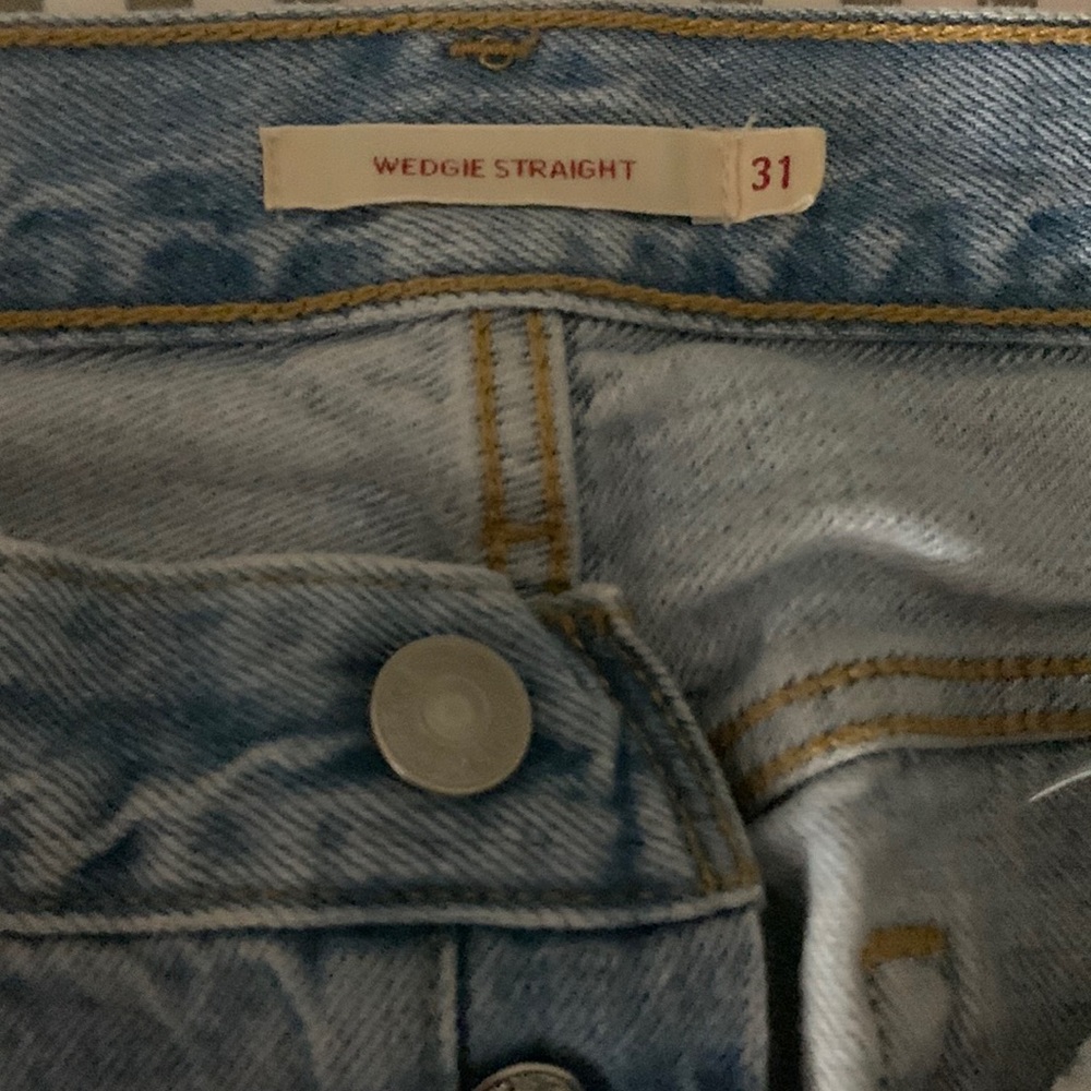Brand new, never worn, size 31 light blue denim wedge Levi’s.